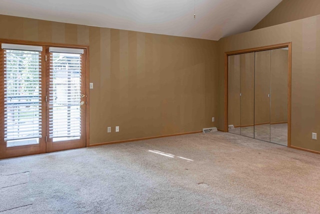 8200 43rd Ave, Kenosha, WI 53142 - unfurnished bedroom featuring multiple windows, access to exterior, carpet floors, lofted ceiling, and baseboards