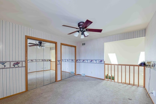 8200 43rd Ave, Kenosha, WI 53142 - unfurnished room featuring wallpapered walls, a ceiling fan, and carpet