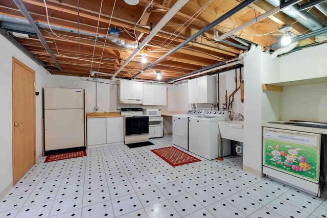 8200 43rd Ave, Kenosha, WI 53142 - laundry room featuring washer and clothes dryer, cabinet space, and light flooring