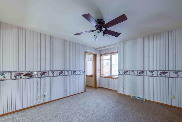 8200 43rd Ave, Kenosha, WI 53142 - unfurnished room featuring a ceiling fan, carpet flooring, baseboards, and wallpapered walls