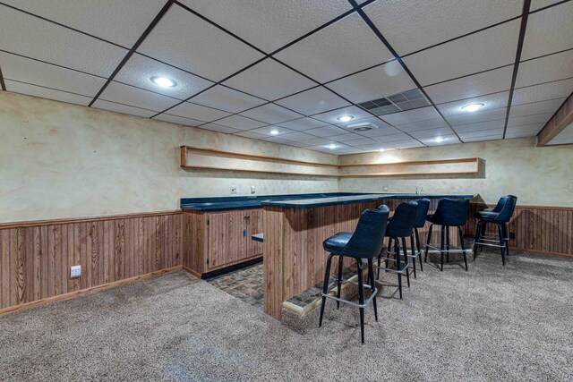 8200 43rd Ave, Kenosha, WI 53142 - indoor bar with carpet flooring, a wainscoted wall, wood walls, recessed lighting, and a drop ceiling