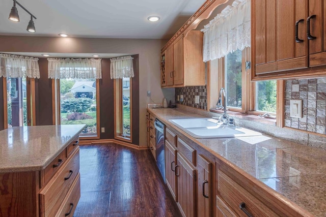 8200 43rd Ave, Kenosha, WI 53142 - kitchen featuring brown cabinetry, a sink, stainless steel dishwasher, and dark wood-style flooring