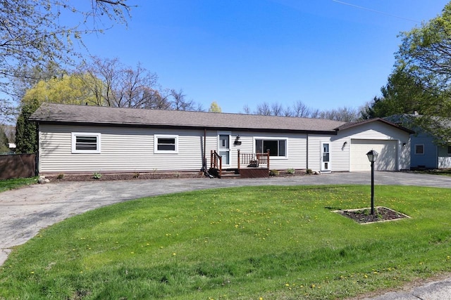 3500 W Justin St, Appleton, WI 54914 - ranch-style house with driveway, an attached garage, a front lawn, and roof with shingles