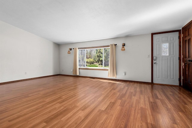 3500 W Justin St, Appleton, WI 54914 - unfurnished living room featuring light wood-style flooring and baseboards