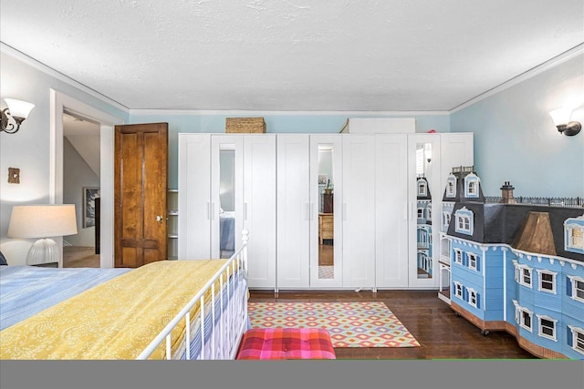 215 W Walworth St, Elkhorn, WI 53121 - bedroom featuring ornamental molding, dark wood-style floors, and a textured ceiling