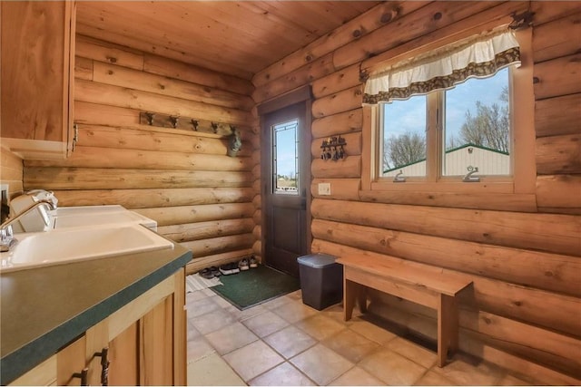 N5502 90th St, Elmwood, WI 54740 - bathroom with log walls, wooden ceiling, vanity, and tile patterned floors