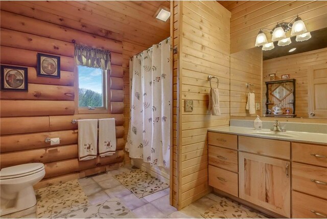 N5502 90th St, Elmwood, WI 54740 - bathroom featuring toilet, vanity, a shower with curtain, and wooden walls