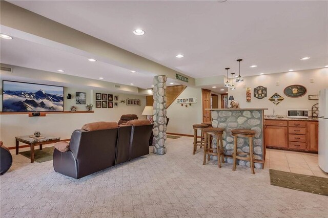 N5502 90th St, Elmwood, WI 54740 - living room featuring light colored carpet, a bar, recessed lighting, and baseboards