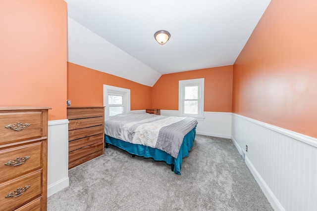 12220 W Highland Rd, Mequon, WI 53097 - bedroom with wainscoting, light colored carpet, and lofted ceiling