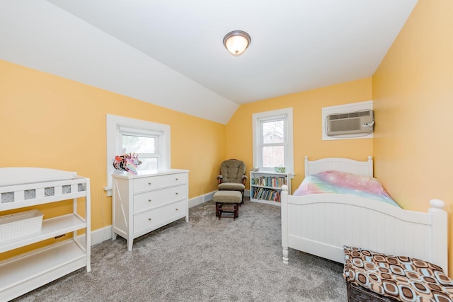 12220 W Highland Rd, Mequon, WI 53097 - carpeted bedroom featuring a wall unit AC, lofted ceiling, multiple windows, and baseboards
