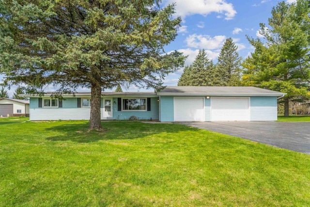 N8584 Snake Rd, Elkhart Lake, WI 53020 - single story home featuring a garage, driveway, and a front lawn