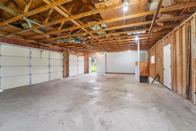 N8584 Snake Rd, Elkhart Lake, WI 53020 - garage featuring a garage door opener