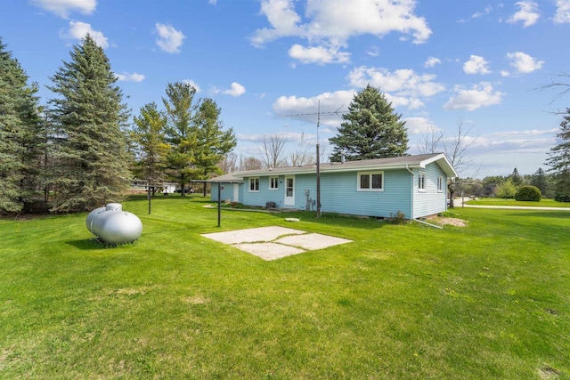 N8584 Snake Rd, Elkhart Lake, WI 53020 - rear view of house with a lawn and a patio area