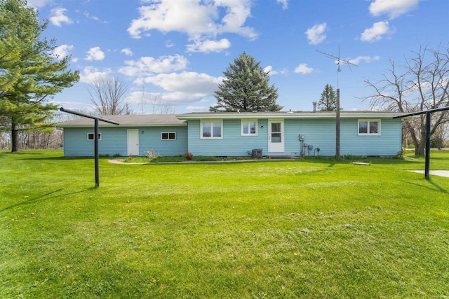 N8584 Snake Rd, Elkhart Lake, WI 53020 - rear view of property featuring a lawn