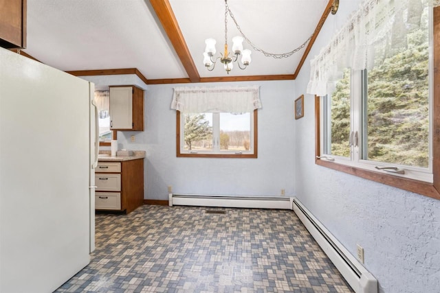N8584 Snake Rd, Elkhart Lake, WI 53020 - unfurnished dining area featuring a baseboard radiator, plenty of natural light, a chandelier, and beam ceiling