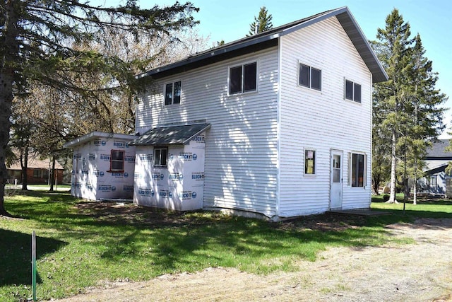 834 W Bayfield St, Washburn, WI 54891 - rear view of house featuring a lawn