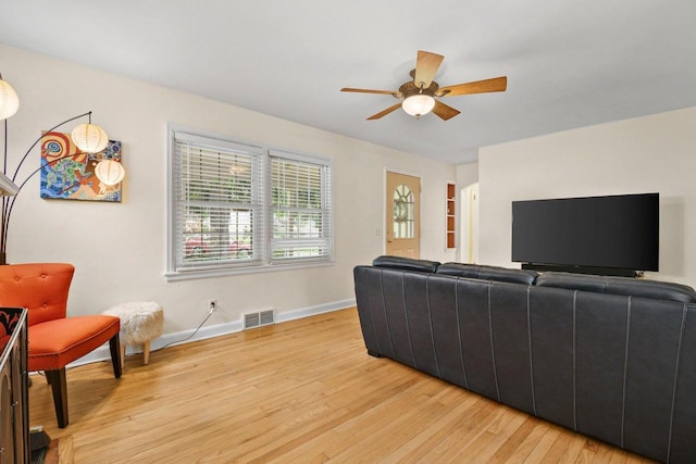 4105 Meyer Ave, Madison, WI 53711 - living room with light wood finished floors, a ceiling fan, and baseboards