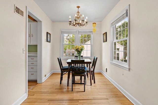 4105 Meyer Ave, Madison, WI 53711 - dining room featuring a chandelier, healthy amount of natural light, and light wood-type flooring