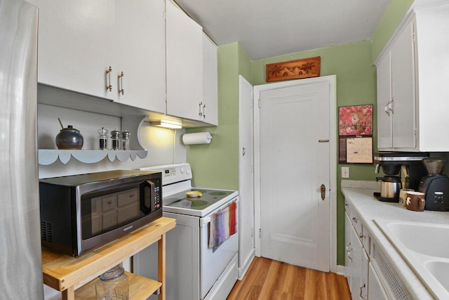 4105 Meyer Ave, Madison, WI 53711 - kitchen with white electric range oven, stainless steel microwave, and white cabinets