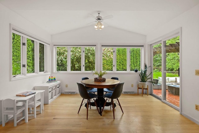 956 Kingston Cir, Sun Prairie, WI 53590 - sunroom featuring healthy amount of natural light, lofted ceiling, wood finished floors, and baseboards