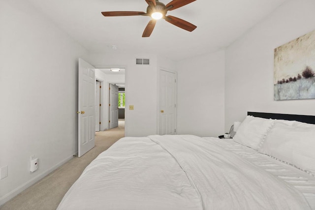956 Kingston Cir, Sun Prairie, WI 53590 - bedroom with light colored carpet, baseboards, and a ceiling fan