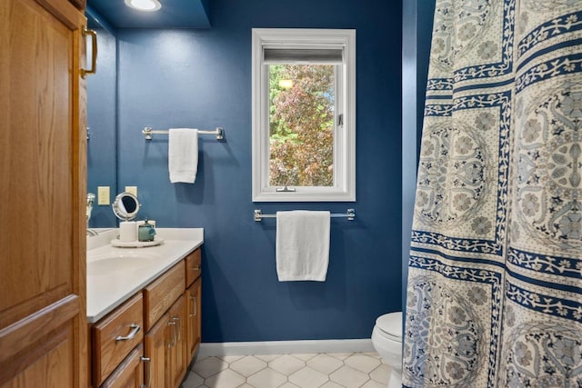 956 Kingston Cir, Sun Prairie, WI 53590 - full bath with vanity, baseboards, toilet, tile patterned flooring, and curtained shower