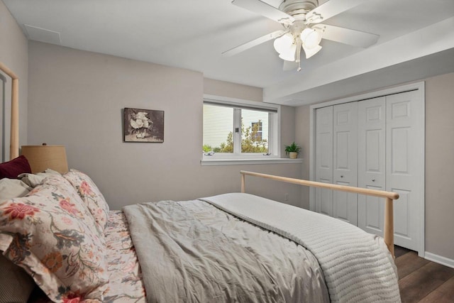 956 Kingston Cir, Sun Prairie, WI 53590 - bedroom with dark wood-style floors, a closet, a ceiling fan, and baseboards