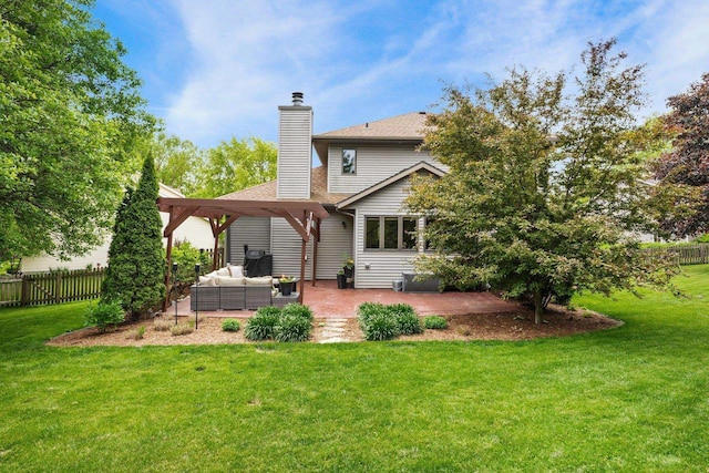 956 Kingston Cir, Sun Prairie, WI 53590 - rear view of property with an outdoor living space, a patio area, a chimney, and roof with shingles