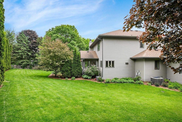 956 Kingston Cir, Sun Prairie, WI 53590 - view of grassy yard with central AC