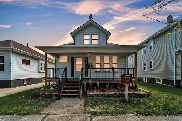 1235 Grove Ave, Racine, WI 53405 - view of front of property featuring a porch and a front lawn