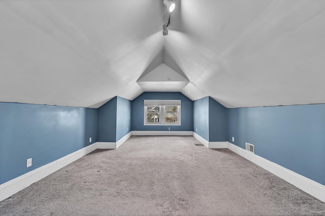 1235 Grove Ave, Racine, WI 53405 - bonus room with vaulted ceiling, carpet floors, and baseboards