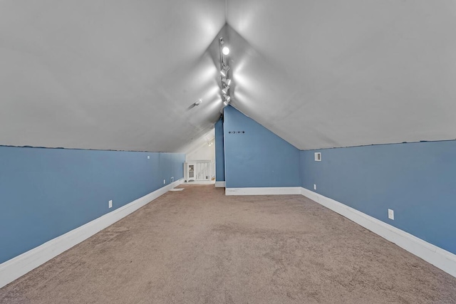 1235 Grove Ave, Racine, WI 53405 - bonus room featuring vaulted ceiling, baseboards, and carpet