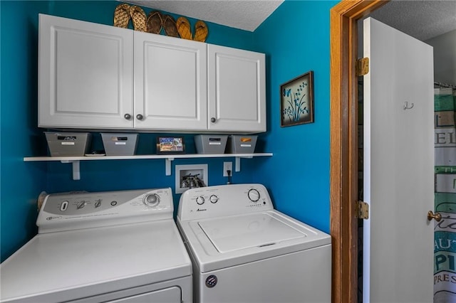 1141 134th Ave, Amery, WI 54001 - clothes washing area featuring cabinet space, washing machine and clothes dryer, and a textured ceiling