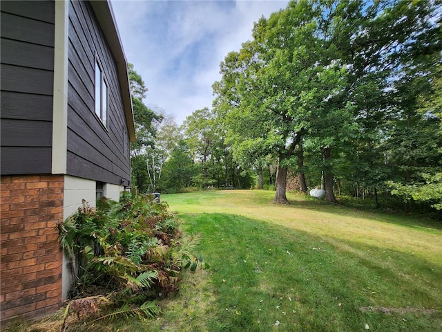 1451 90th Ave, Amery, WI 54001 - view of green lawn with view of wooded area