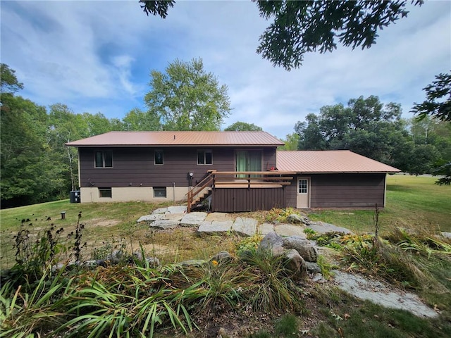 1451 90th Ave, Amery, WI 54001 - back of property featuring a deck, metal roof, and stairs