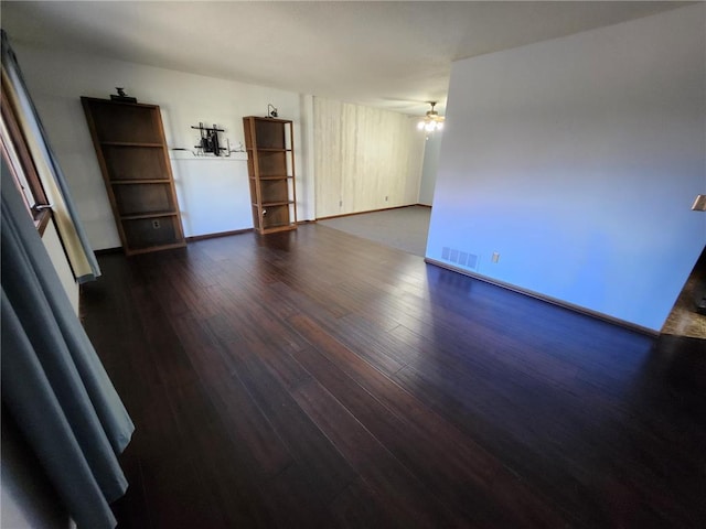 1451 90th Ave, Amery, WI 54001 - empty room with dark wood-style floors, baseboards, and a ceiling fan
