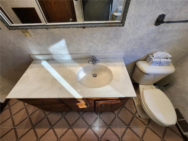 1451 90th Ave, Amery, WI 54001 - bathroom featuring toilet, vanity, and tile patterned floors