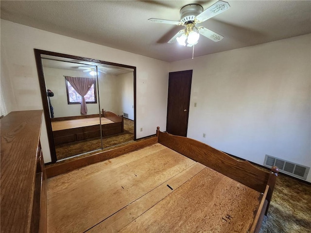 1451 90th Ave, Amery, WI 54001 - unfurnished bedroom with a ceiling fan and a closet