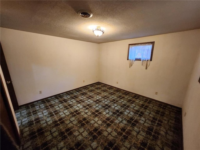 1451 90th Ave, Amery, WI 54001 - empty room featuring a textured ceiling
