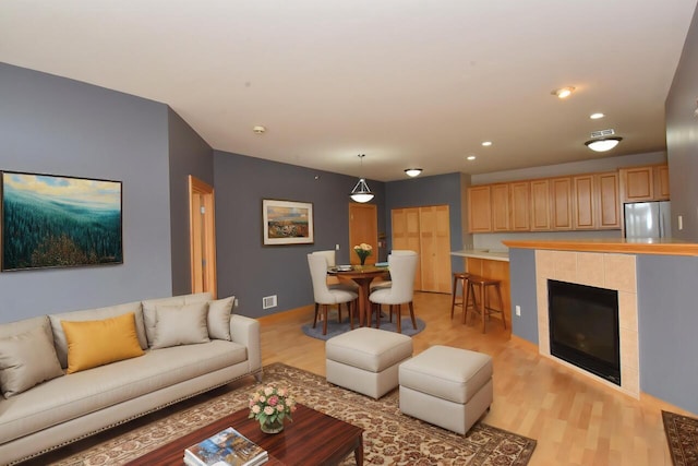 110 S Wisconsin St Unit 2E, Port Washington, WI 53074 - living room featuring light wood finished floors and recessed lighting