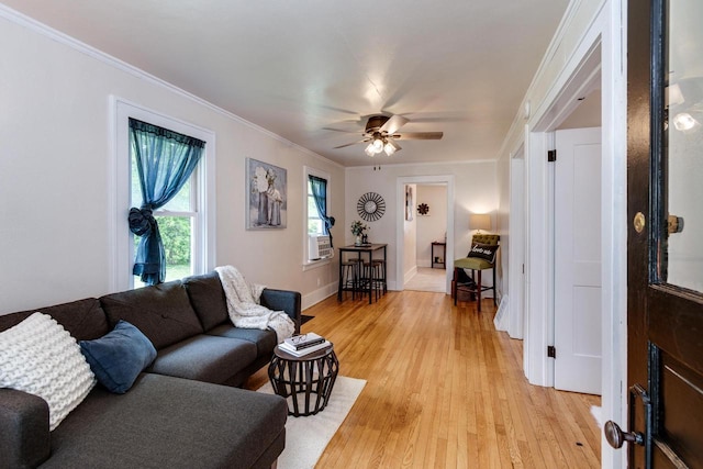932 Washburn St, Beloit, WI 53511 - living area featuring light wood-style flooring, crown molding, a ceiling fan, baseboards, and cooling unit