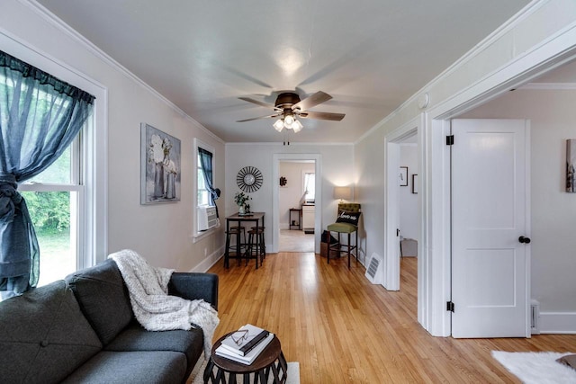 932 Washburn St, Beloit, WI 53511 - living area with light wood-style floors, a ceiling fan, crown molding, and baseboards