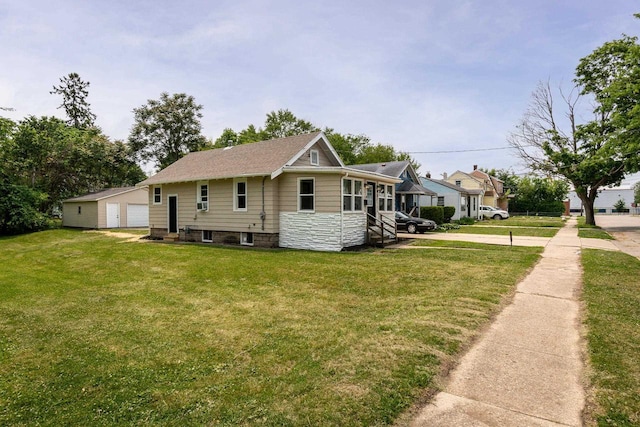 932 Washburn St, Beloit, WI 53511 - view of home's exterior featuring a yard, a detached garage, and stone siding