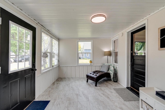 932 Washburn St, Beloit, WI 53511 - sunroom / solarium featuring wainscoting and marble finish floors