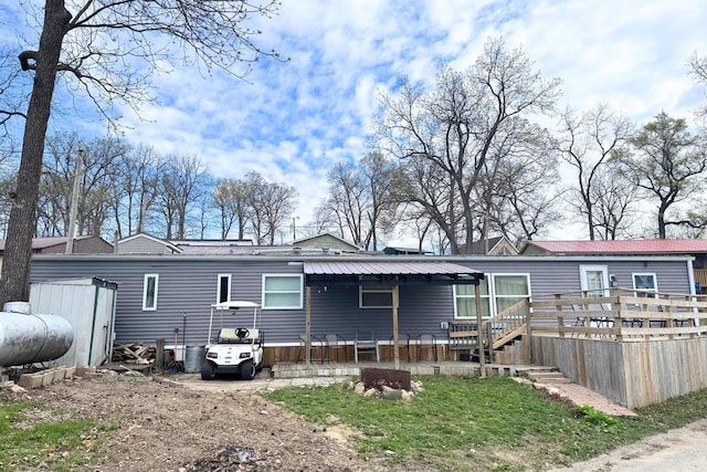 21701 259th St, Delhi, IA 52223 - back of property with a deck