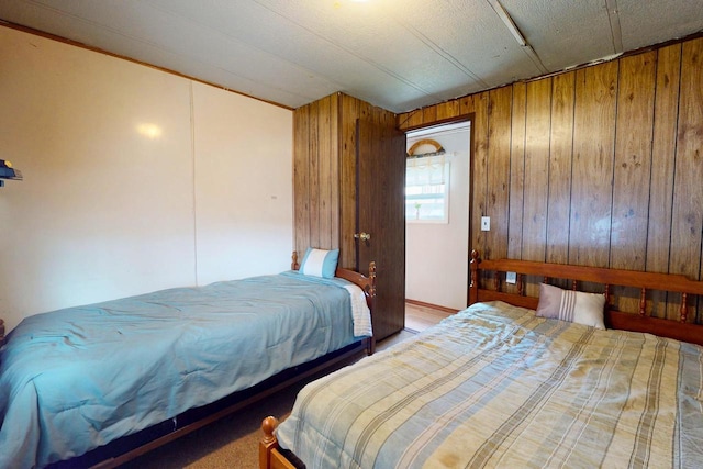 21701 259th St, Delhi, IA 52223 - bedroom featuring wooden walls