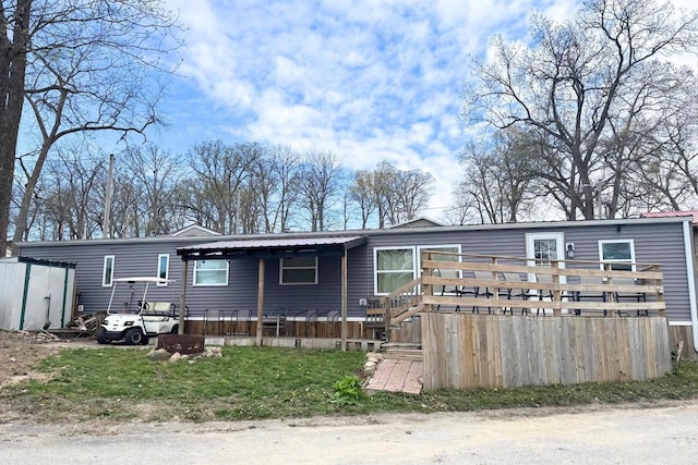 21701 259th St, Delhi, IA 52223 - manufactured / mobile home with a deck