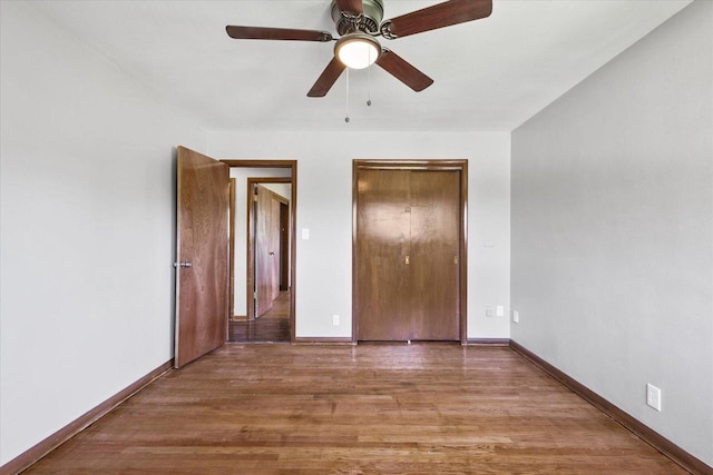 7224 Dartmoor Ave, Greendale, WI 53129 - unfurnished bedroom with baseboards, wood finished floors, ceiling fan, and a closet