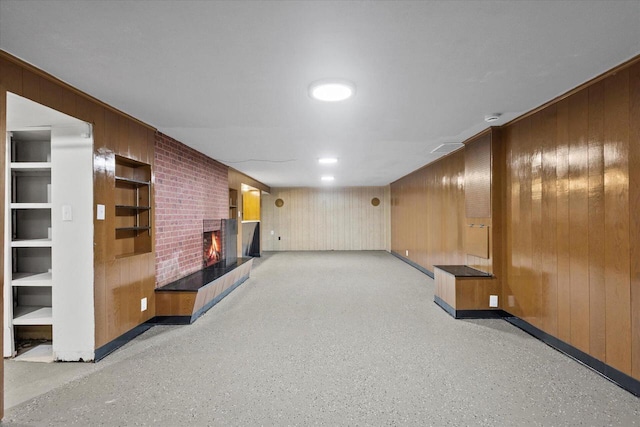 7224 Dartmoor Ave, Greendale, WI 53129 - finished basement featuring wood walls, a brick fireplace, and baseboards