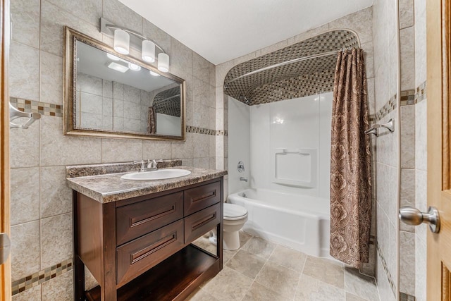 2780 Humboldt Rd, Green Bay, WI 54311 - bathroom with tile walls, shower / bath combo with shower curtain, vanity, and toilet